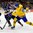 BUFFALO, NEW YORK - JANUARY 2: Sweden's Linus Lindstrom #16 attempts a shot on goal past Slovakia's Tomas Hedera #3 during the quarterfinal round of the 2018 IIHF World Junior Championship. (Photo by Andrea Cardin/HHOF-IIHF Images)

